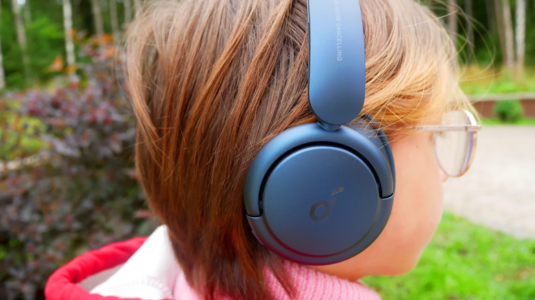 A child wearing wireless headphones