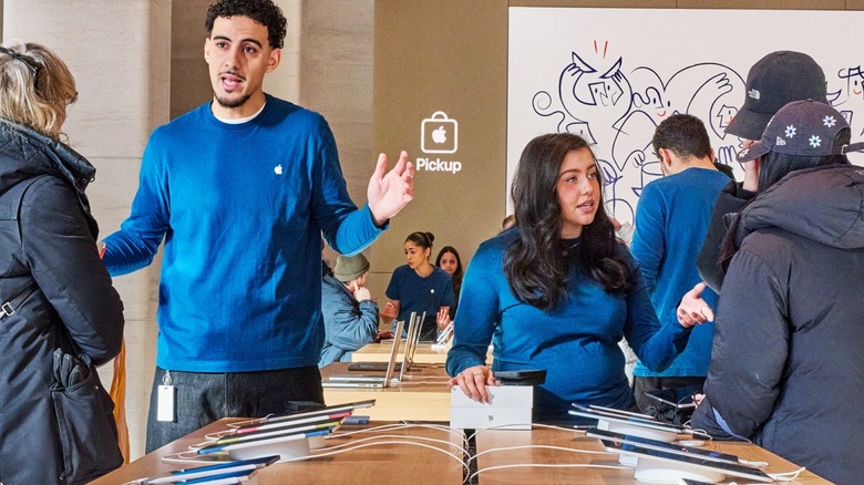 Inside an Apple Store with Apple sales employees, and the Pickup spot in the back