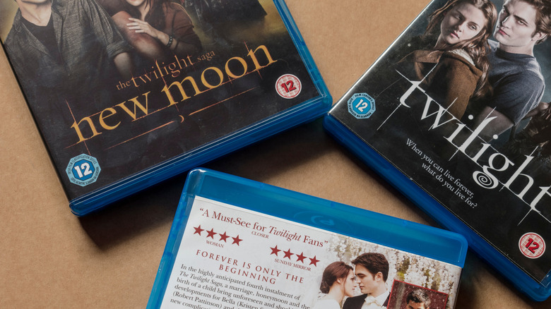 Twilight and New Moon Blu-ray cases displayed on a table.
