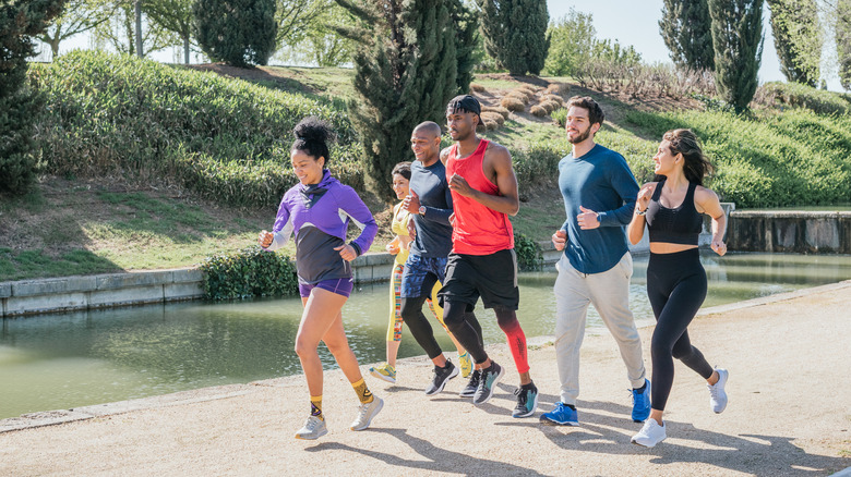 Group of runners training in a park.