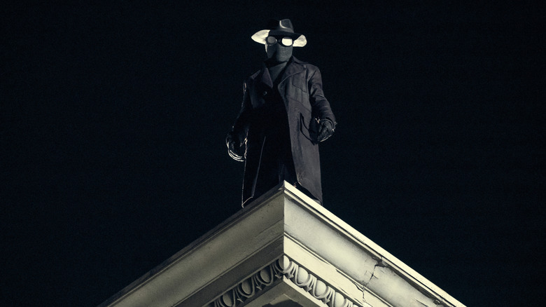 Spider-Noir stood on a rooftop looking down