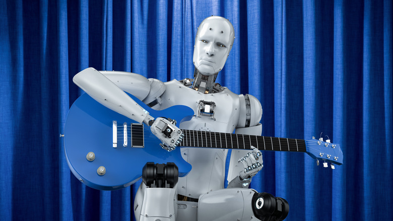 A robot holding a guitar