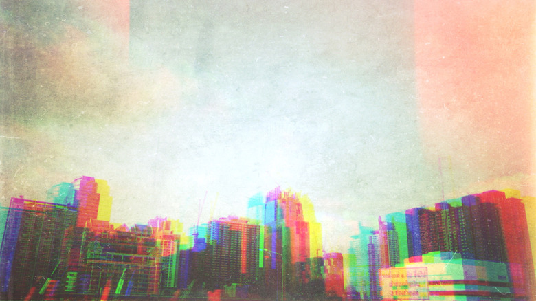 A city skyline with inconsistent lighting.