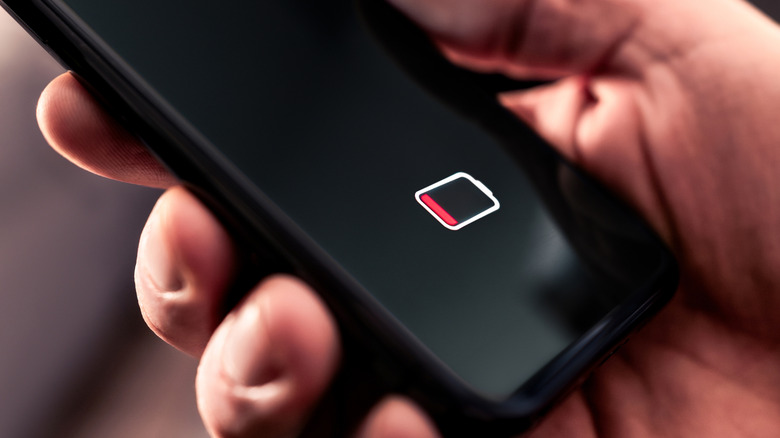 A smartphone displaying the dead battery indicator on the screen