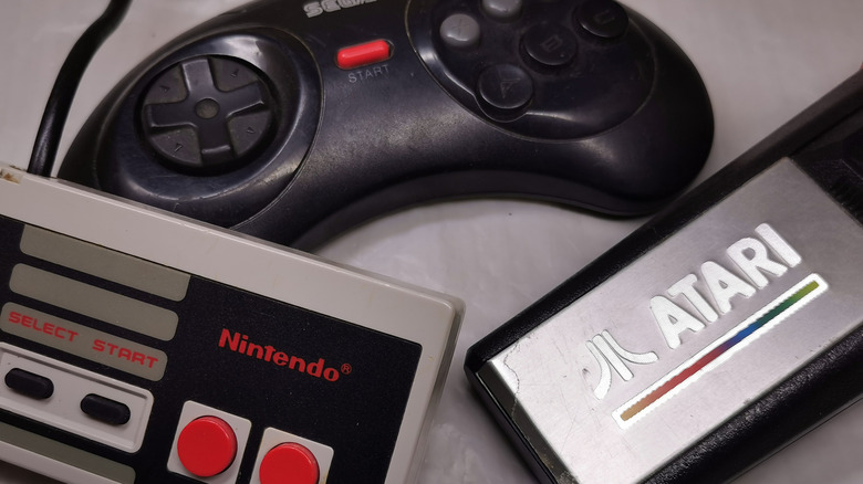 An assortment of vintage game controllers