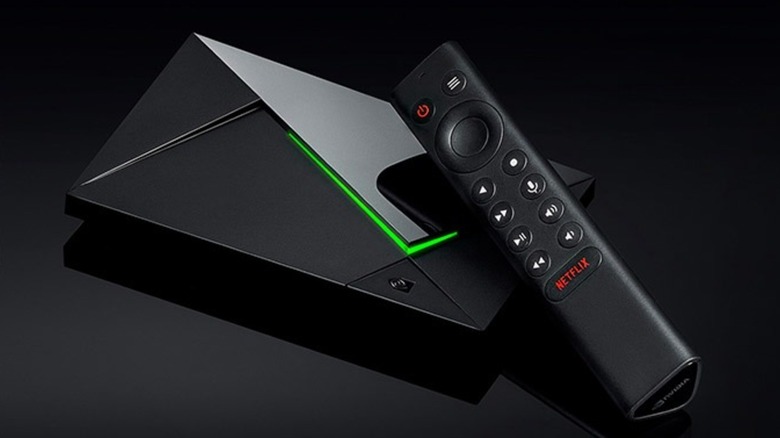 Nvidia Shield TV Pro with remote in front of black background