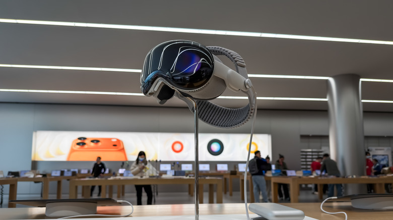 An Apple Vision Pro headset is displayed inside an Apple Store