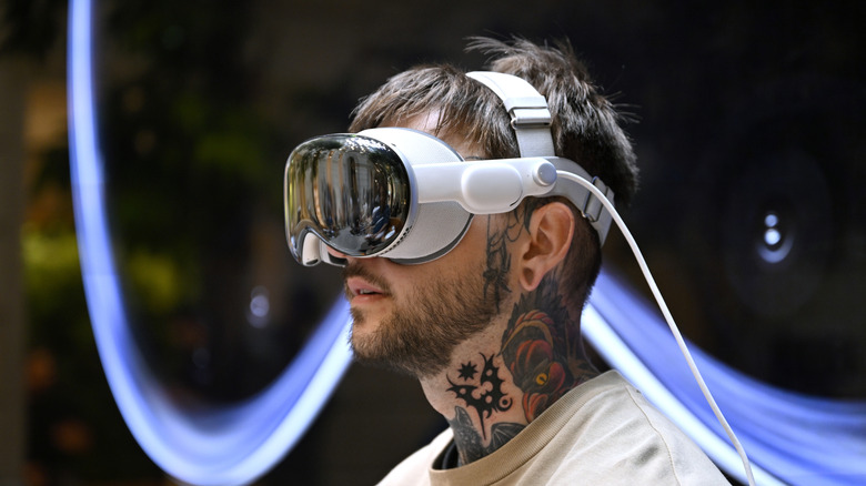 customer tries the device for the first time at the Apple Champs-Élysées store during the launch of the Apple Vision Pro