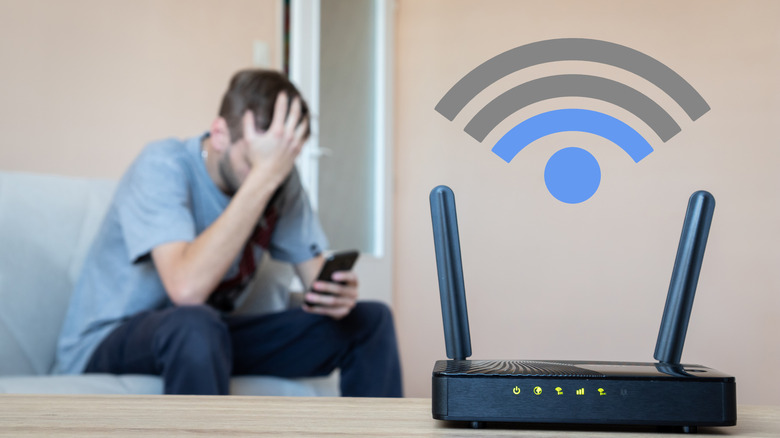 person shows frustration due to low signal strength from the router