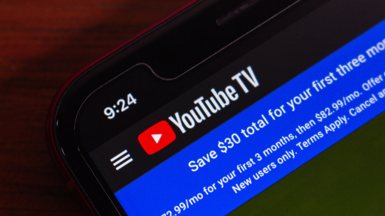 Close-up of a smartphone screen displaying the YouTube TV website
