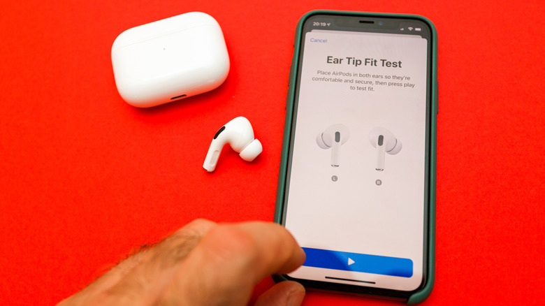 Person performing the ear tip fit test for AirPods Pro on an iPhone