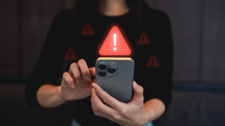 Person receiving notification alerts on a smartphone
