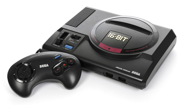 Sega Genesis console with a matching controller shown on a white background.