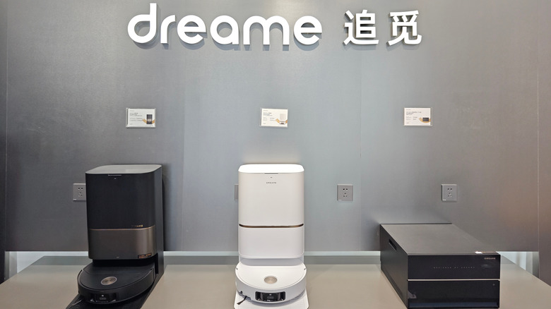 Three different Dreame robot vacuums on display.