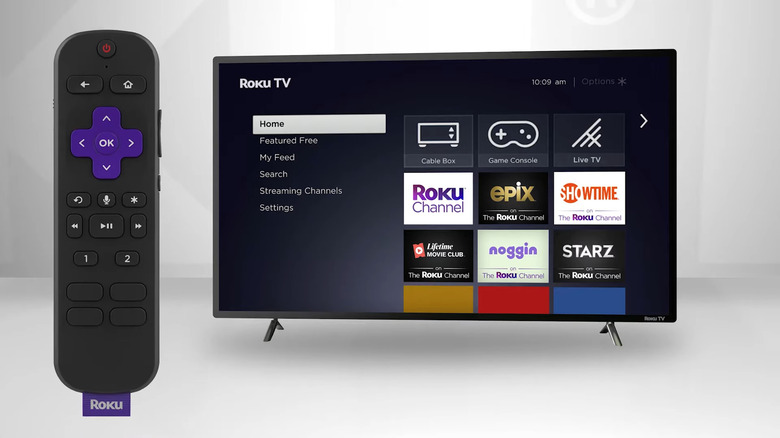 Roku Voice Remote Pro with personal shortcut buttons next to Roku TV