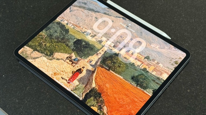iPad Pro on a table with the Apple Pencil Pro attached to the tablet