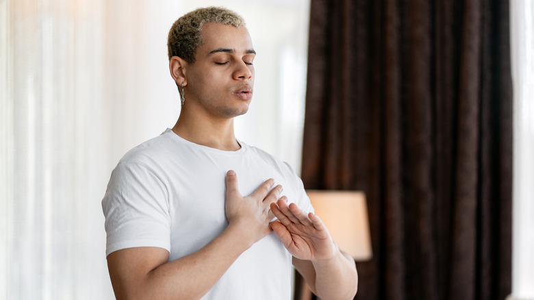 A person taking a deep breath.