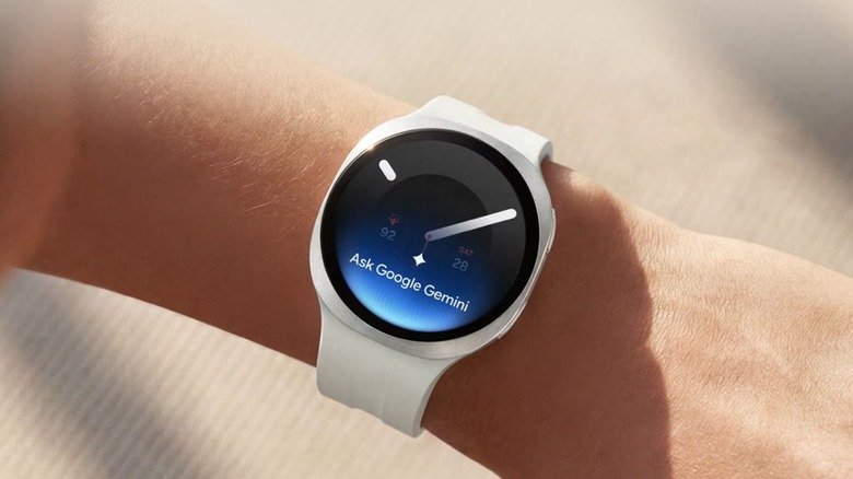 A person wearing the Samsung Galaxy Watch 9 (44mm) smartwatch with Google Gemini on the screen.