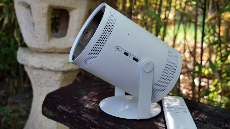 Samsung Freestyle portable projector on stand outdoors in natural light