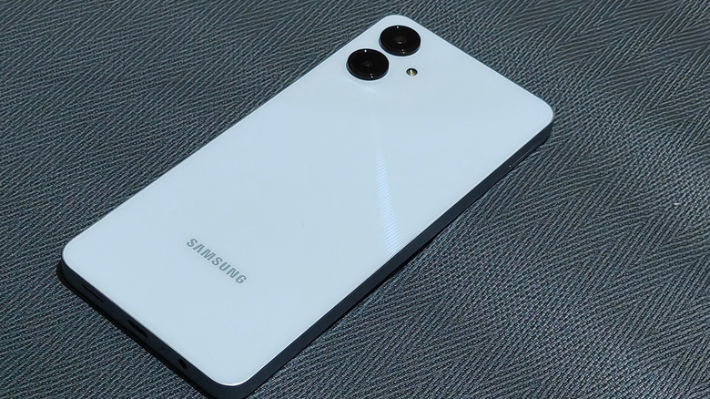 A picture of a Samsung Galaxy A06 in white, featuring two cameras on the back