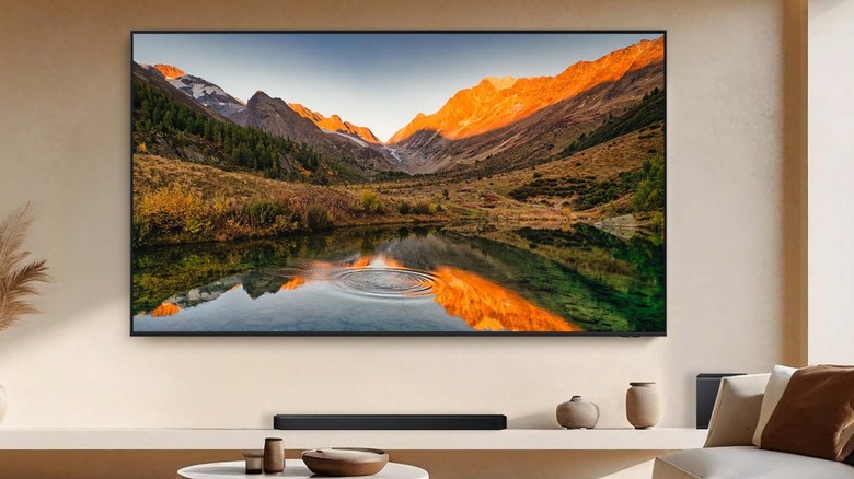 Neo QLED QN90F 4K Samsung smart TV mounted to wall in den
