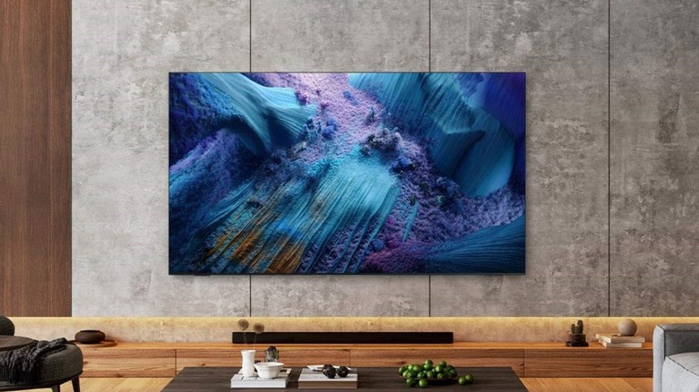 Neo QLED QN990F 8K Samsung smart TV mounted on wall in den