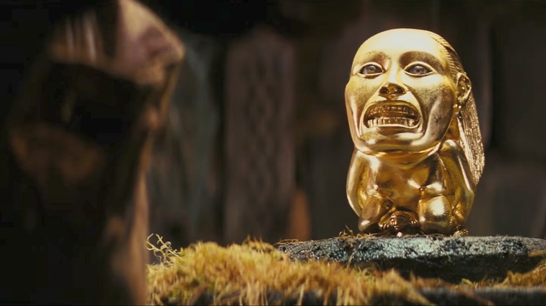 Indiana Jones preparing to steal the golden idol in Raiders of the Lost Ark