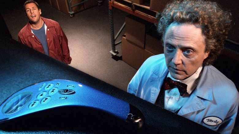Adam Sandler and Christopher Walken looking at the remote in Click