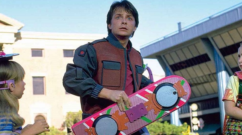 Marty holding his hoverboard in Back to the Future Part II