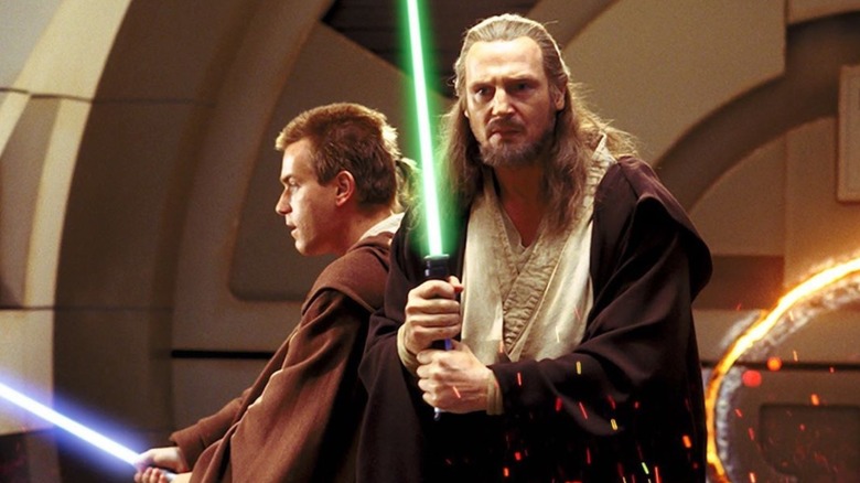 Obi-Wan Kenobi and Qui-Gon Jinn with their lightsabers in The Phantom Menace