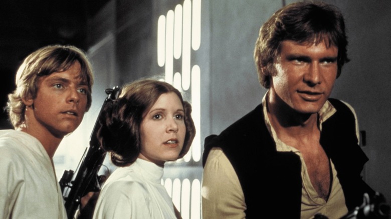 Luke Skywalker (Mark Hamill) Princess Leia (Carrie Fisher) and Han Solo (Harrison Ford) in A New Hope
