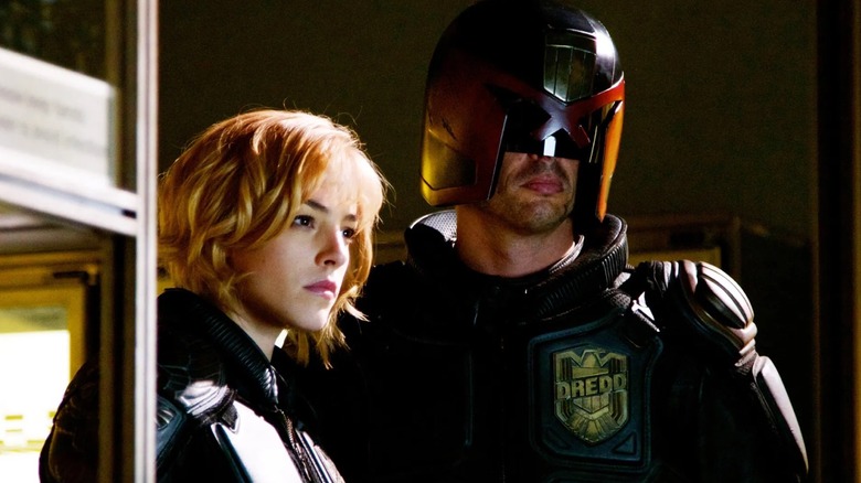 Judge Anderson and Judge Dredd standing together in Dredd