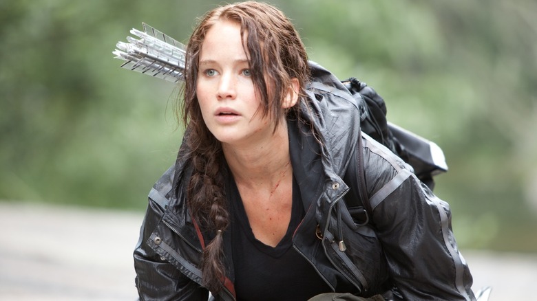 Katniss Everdeen (Jennifer Lawrence) kneeling in The Hunger Games