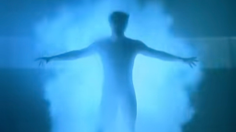 A man silhouetted against a blue background from the show open of "Quantum Leap"