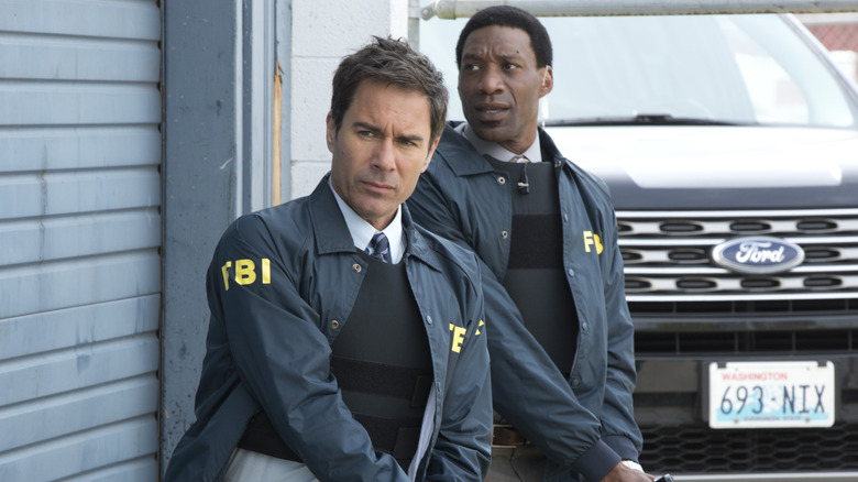 Grant and Walt casing a building during an investigation in 