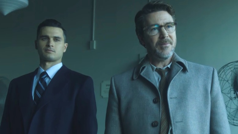 Captain Michael Quinn and Dr. J. Allen Hynek standing side by side, smiling, in "Project Blue Book"