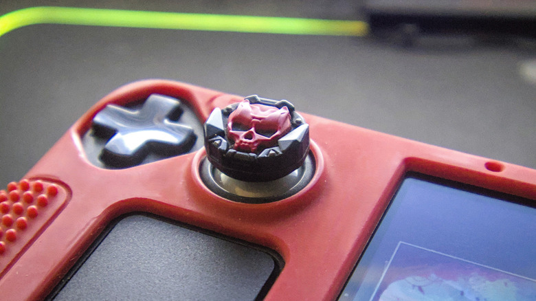 Steam Deck custom joystick cap with skull and red case on exterior