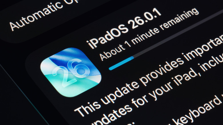 A closeup of the iPad software update screen, the iPad is updating to iPadOS 26.0.1 and the update has about a minute remaining