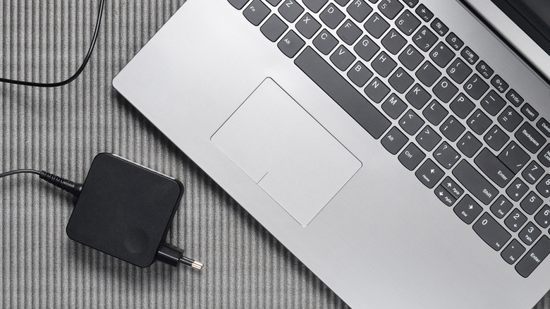 Laptop and charger on a desk