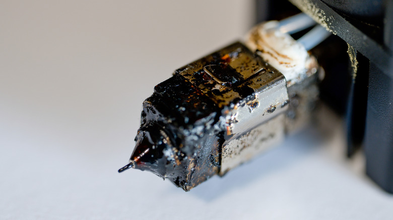 A damaged 3D printer extruder.