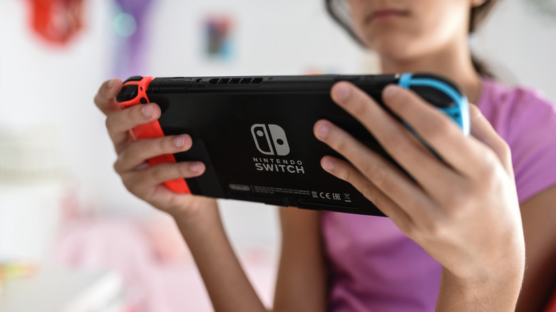 A child playing the Nintendo Switch console