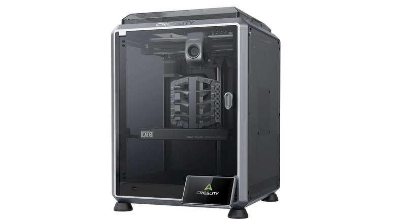 Creality K1C enclosed 3D printer with a model inside.
