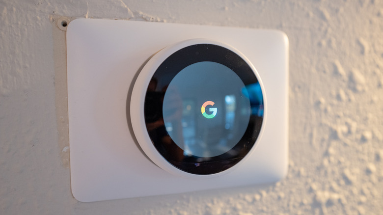 Smart home with solar panels and connected technology icons