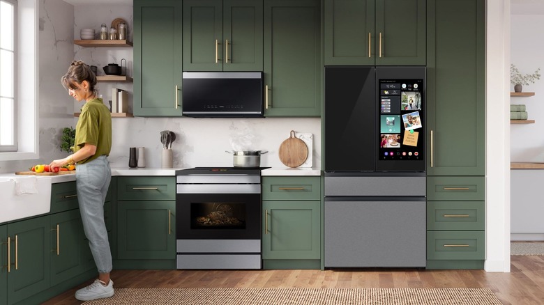 Kitchen with a smart fridge featuring a built-in touchscreen display