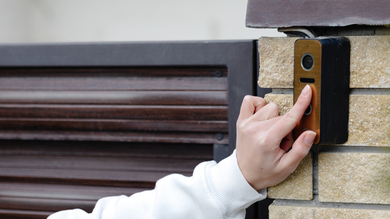Person using a smart video doorbell