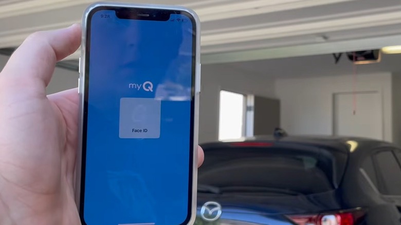 Person using an app to control a garage door