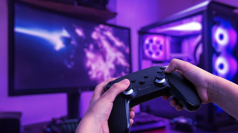 Gamer in a gaming room with LED lights