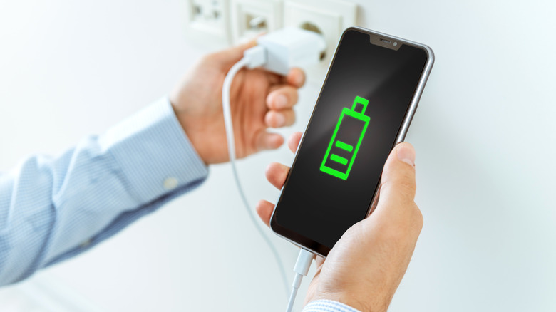 Person charging a phone