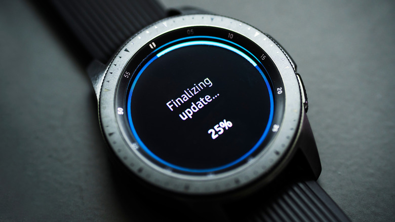 A smartwatch displaying a software update on the screen