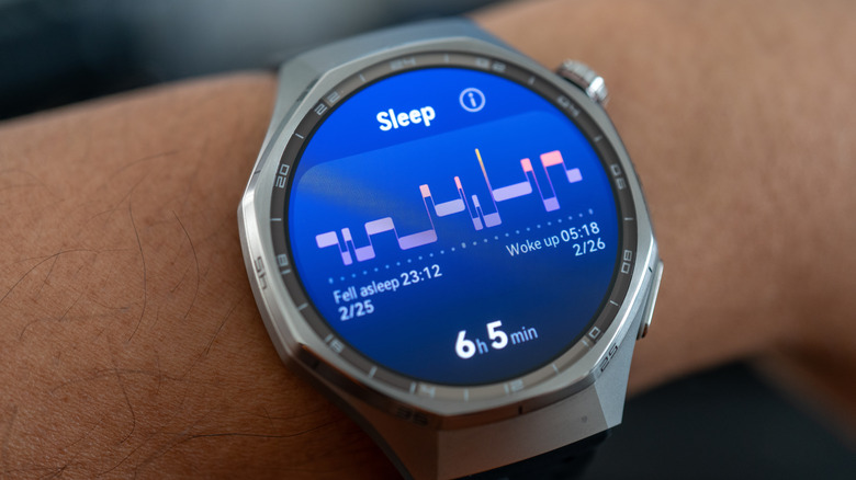 Close-up of a smartwatch showing sleep stats with a graph.